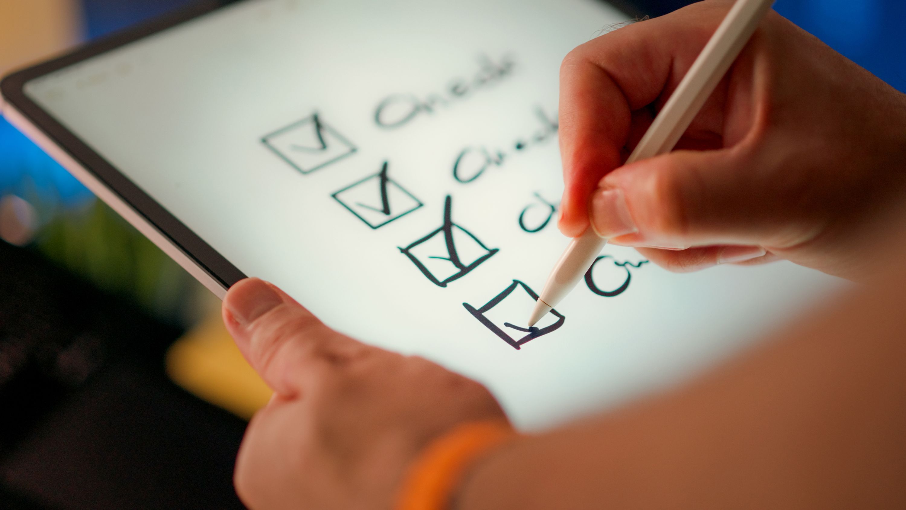 Person ticking of checklist for office supplies